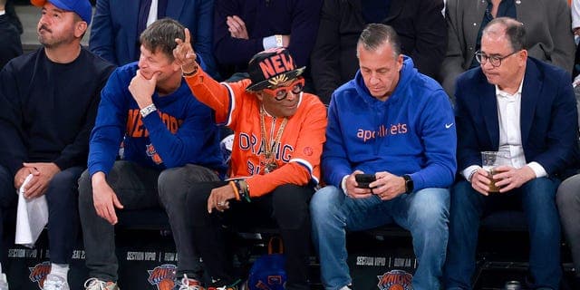 Knicks fans courtside at an NBA Finals game